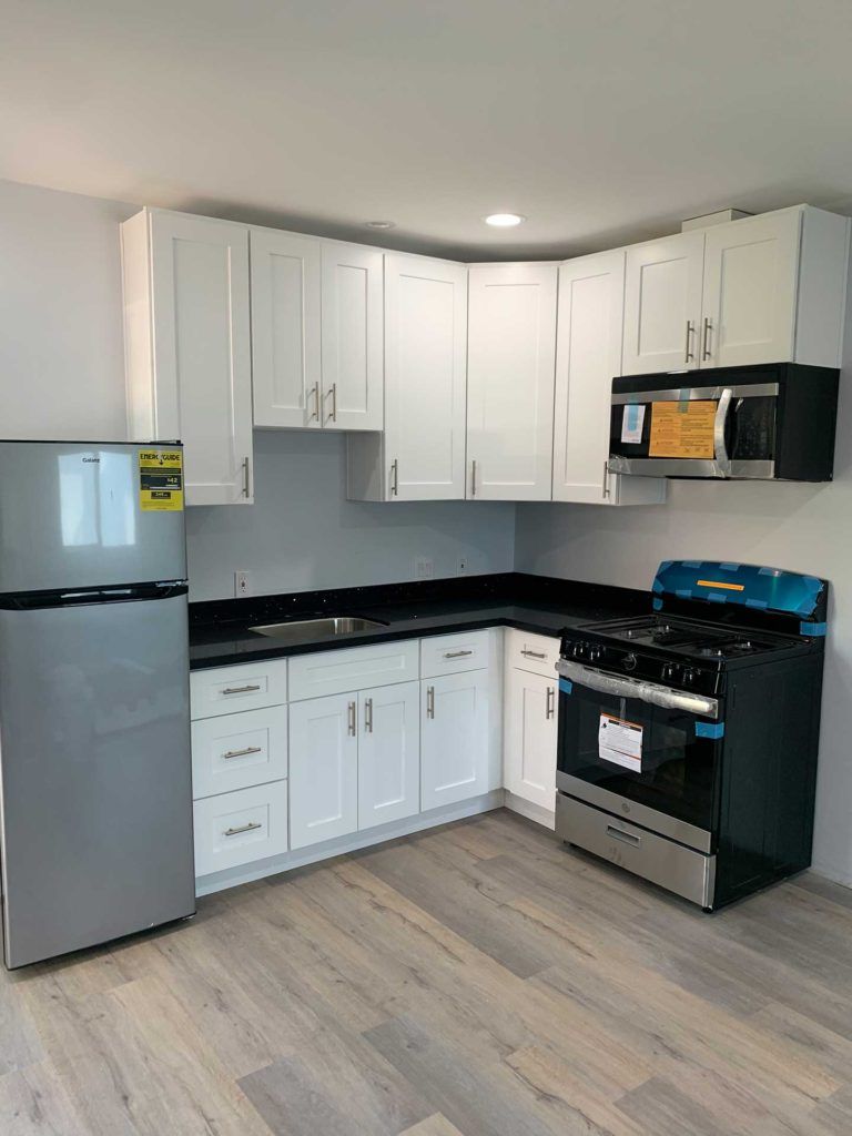 kitchen white cabinetry with new fridge oven and stove