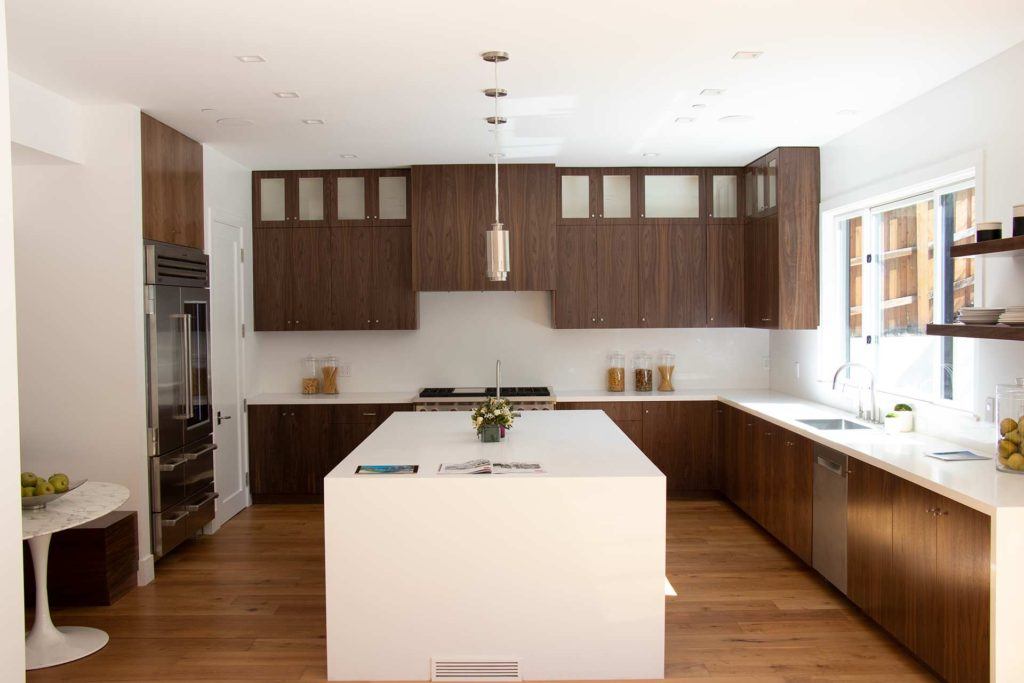 kitchen with brown cabinetry and white island