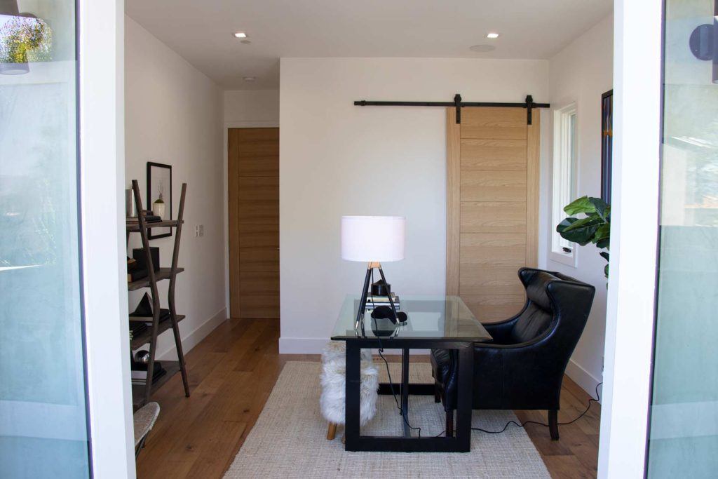 office with black desk and leather chair