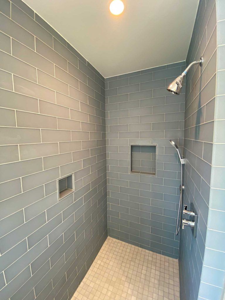 interior of shower with rectangular tiles