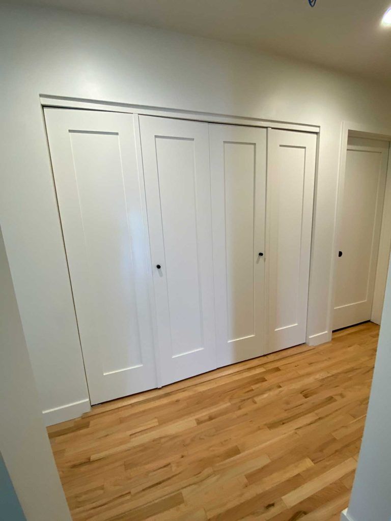 closed white double door closet